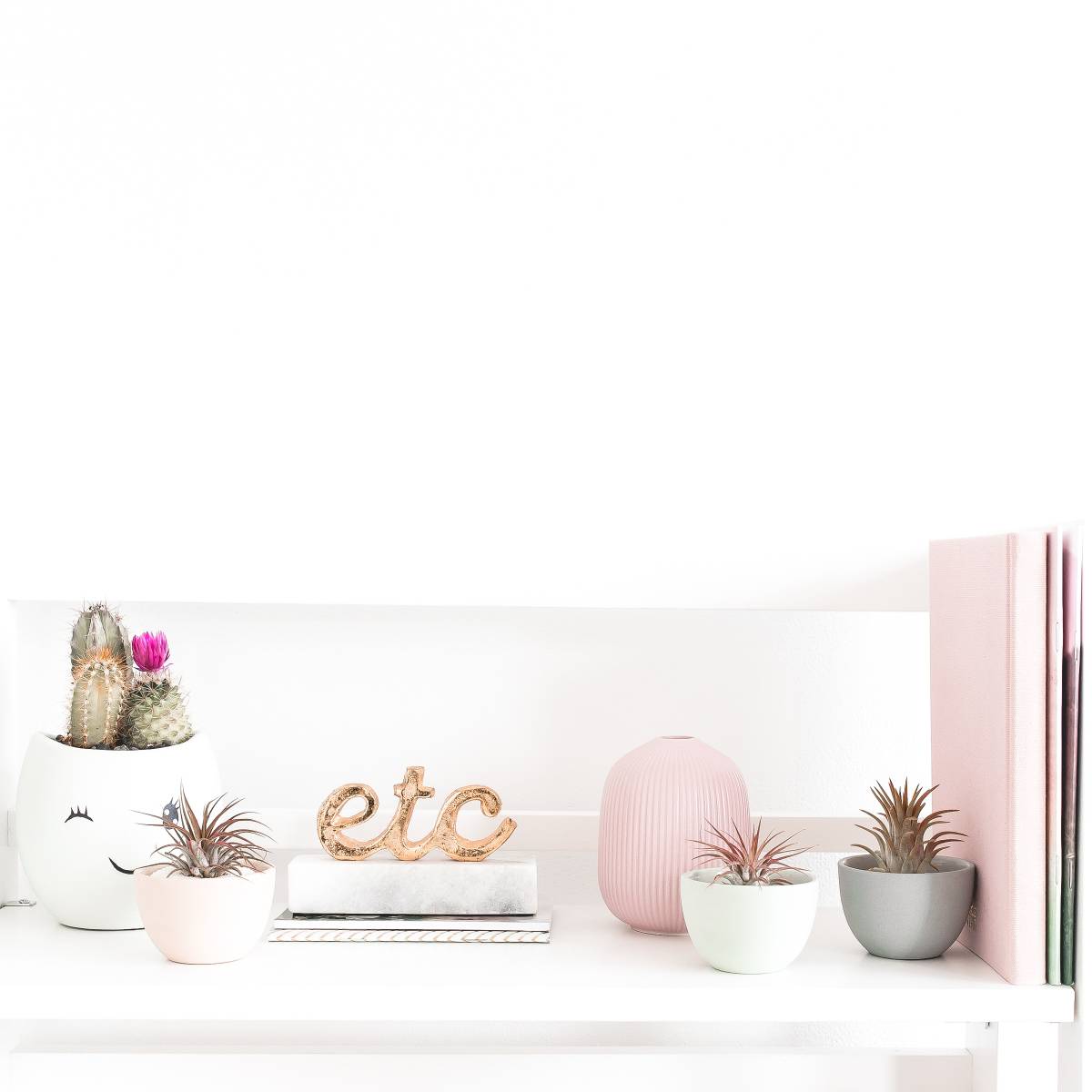 miscellaneous desk supplies sitting on a white table