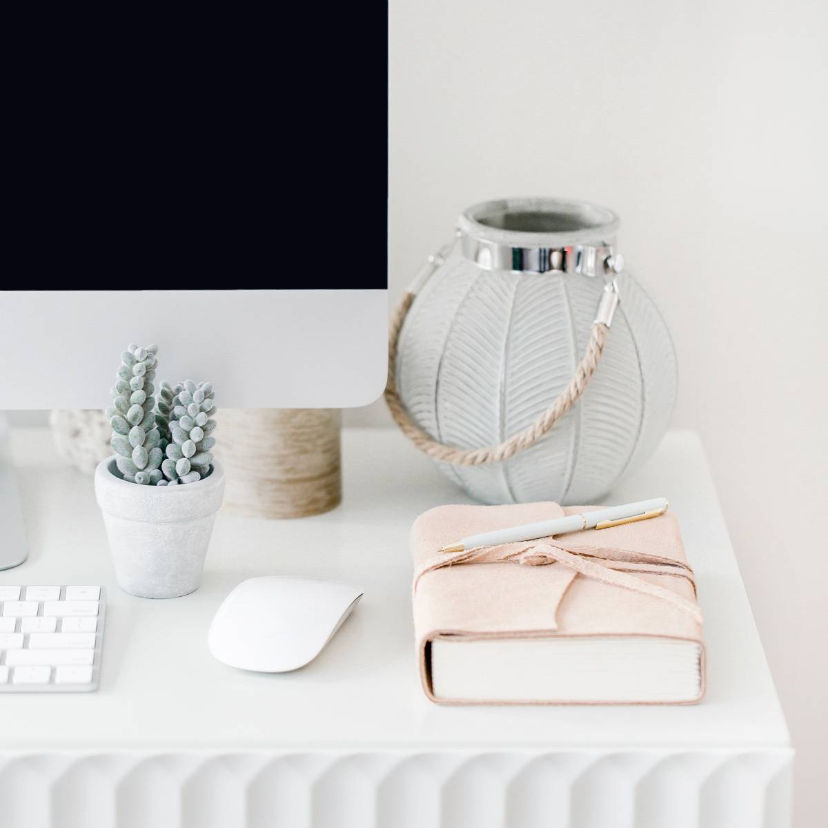 pink journal on a white desk